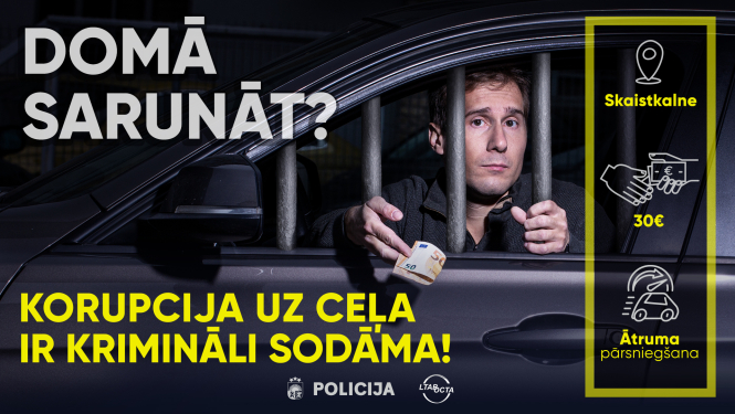 Kapmaņas "Domā sarunāt?" vizuālais materiāls, kur redzams vīrietis automašīnā sniedzam banknoti, bet stikla vietā ir restes